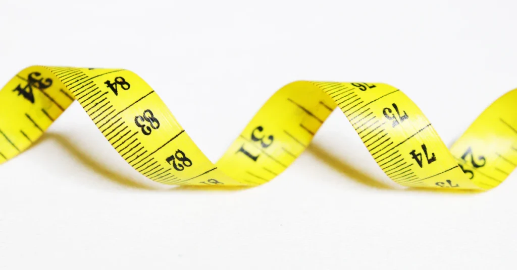 Yellow measuring tape with inch markings
