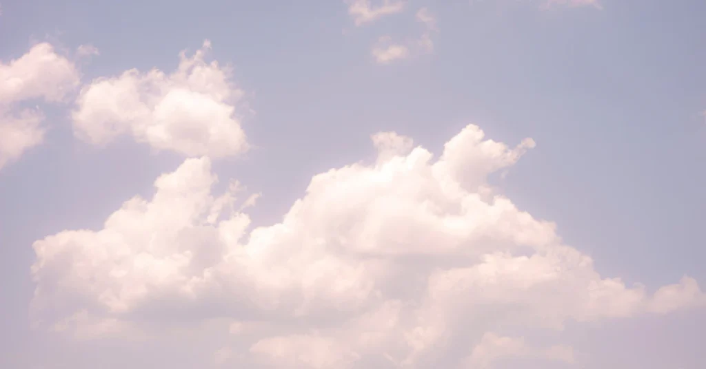 Cloud floating above ground showing warm air updrafts keeping it suspended