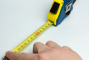 Tape measure showing height measurement in centimeters