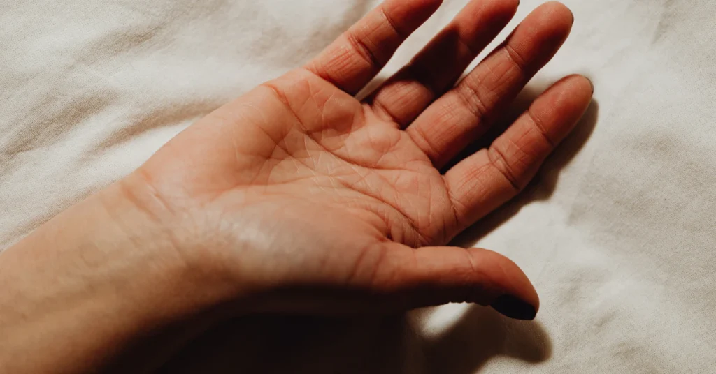 Open adult hand with fingers spread, a natural way to estimate 20 cm using hand span