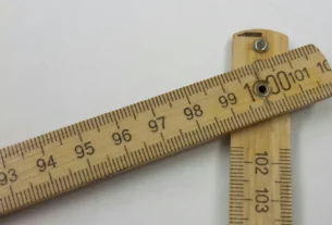 Wooden folding ruler with centimeter and inch markings