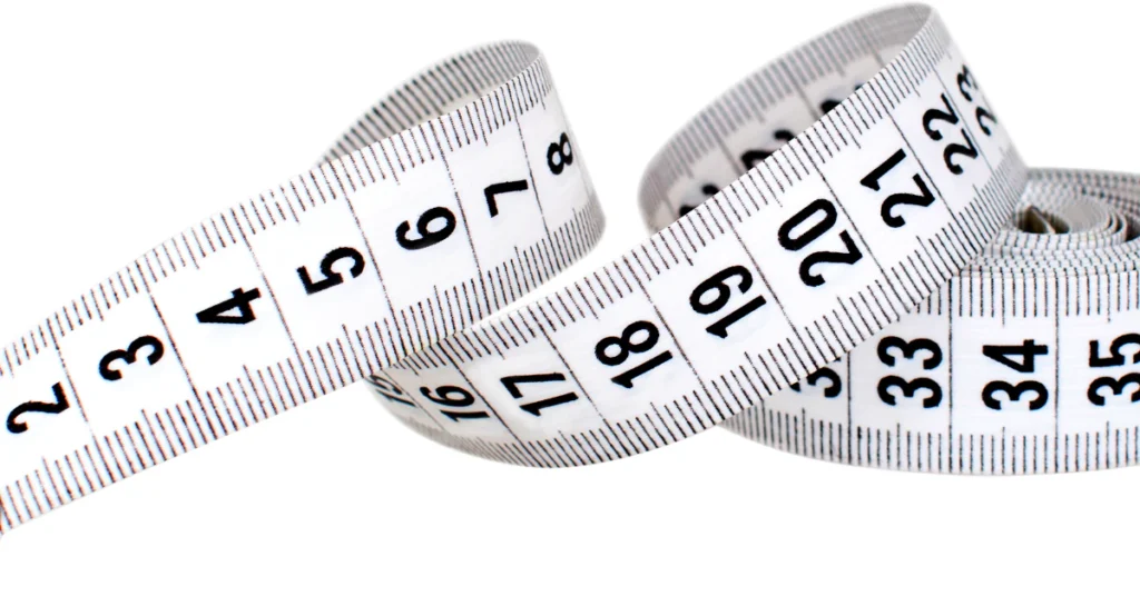Measure 4 inches without a ruler, white tape measure with inch markings