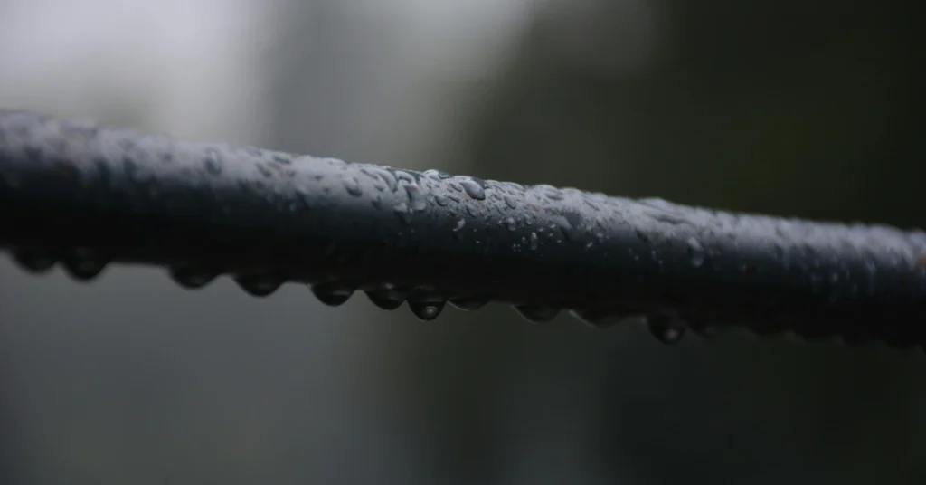 Close-up of a knurled steel bar grip, texture of a Super EZ bar